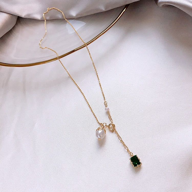 Gold, Emerald, and Pearl Necklace